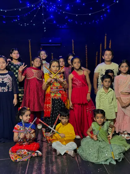 Our talented students dressed in traditional attire for our Navratri showcase. We celebrate festivals with special choreography, creating memorable experiences and performances for everyone involved.