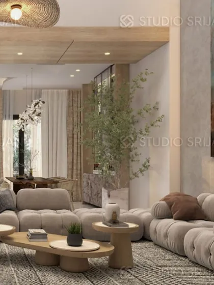 A comfortable, modern living room featuring a plush, tufted "caterpillar" sofa and a large, rustic-style woven light fixture.