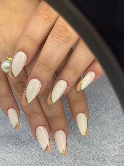 A modern and elegant design with a milky white base and a negative space accent outlined in gold.