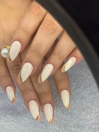 A chic and minimalist design with a milky white base and delicate gold line details.