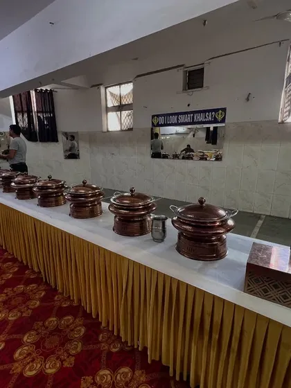A buffet line featuring our traditional copper chafing dishes, which add a touch of class and keep the food warm for your guests.