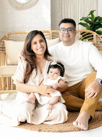 A full view of a family session in our boho studio. The setup includes beautiful floral arrangements that add a touch of color and softness to the natural decor.