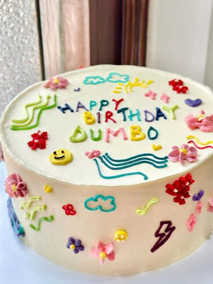 Another look at the vibrant and playful doodle cake. We can incorporate any symbols or characters that are meaningful to you.