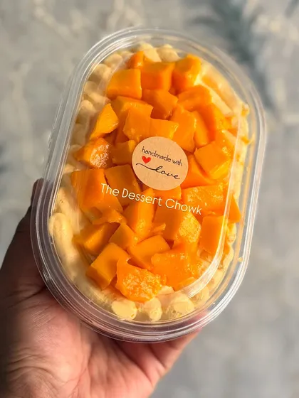 My Fresh Mango Cake Tub, packaged and sealed with a "handmade with love" sticker. It's a perfect seasonal treat to go.