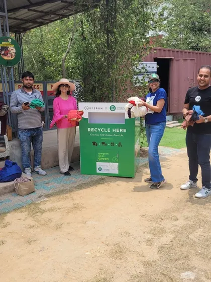 Citizens posing with our new textile recycling bin. Partnering with Respun, we have placed these permanent bins at our collection hubs to make donating your old clothes easy and impactful.