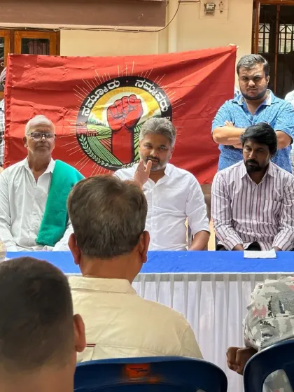 Seated with community members and elders under the banner of 'Nammuru Nammavaru'. This image reflects a typical day of grassroots advocacy, where we strategize and discuss the path forward for our taluk.