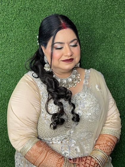Makeup for her 25th anniversary. What an honor. We went for a timeless, elegant look with a bold lip and classic silver glitter on the eyes to celebrate such a special day.