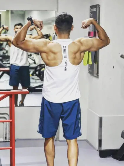 A strong back is the foundation of a strong lifter. This pose shows the result of consistent training on the muscles that power every pull and lift.