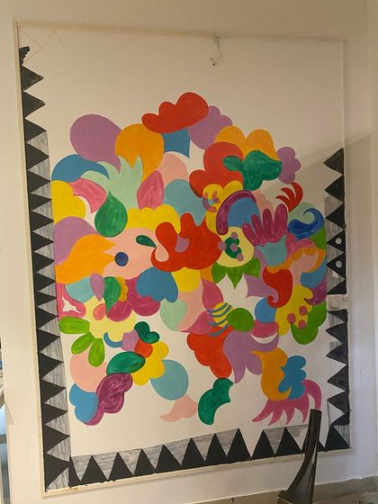 Here’s a look at the 'Freedom Mural' midway through. You can see how I layer shapes and colors, starting with big, bold forms and then filling them with intricate patterns. This layering process is what gives the final piece its depth.