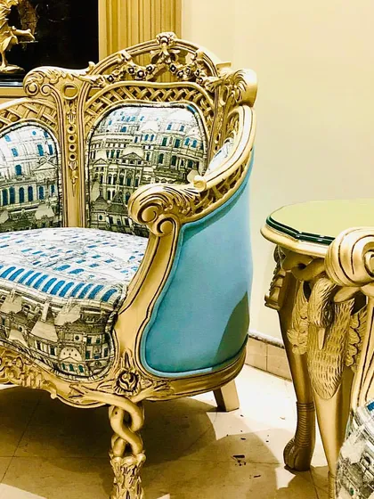 A detail shot of the refurbished armchair, where we used a unique architectural-print fabric to give this ornate, classic piece a contemporary and personalized twist.