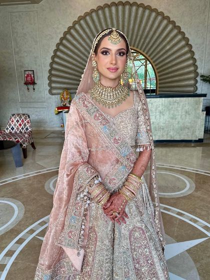 A full-length portrait of my bride Anjali. Her signature summer bridal glow was achieved with careful skin prep and layering to ensure it looked dewy and flawless all day.