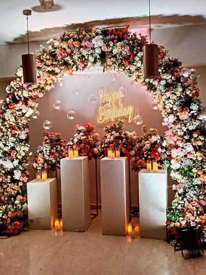 Here you can see the scale of the floral arch decoration. These lush, flower-heavy designs make a big impact and serve as a stunning photo backdrop for guests.