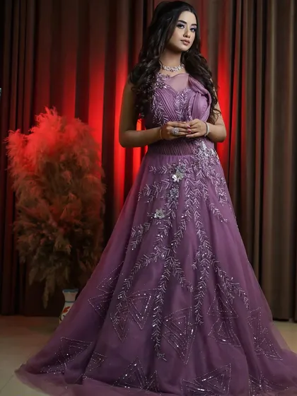 This onion pink bridal gown is one of my latest arrivals, perfect for the bride looking for a unique color. The intricate silver embroidery and sculpted shoulder detail make it a true work of art.