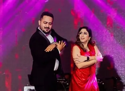 A couple from the family enjoying their duet performance. We choreograph for everyone, not just the main couple.