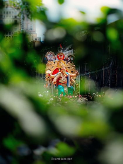 A perfectly framed shot of the famous Chinchpokli Cha Chintamani, seen through the leaves. It was a crowded day, but this view felt like a personal blessing from Bappa, reminding me that he always shows a way, even in chaos.