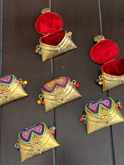 For something truly unique, I offer these metal coin boxes with colorful, hand-beaded lids. They are vibrant, fun, and celebrate the incredible craftsmanship of our artisans.