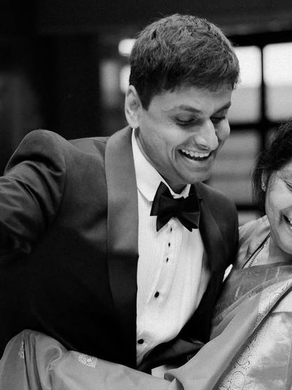The pure joy of a son dancing with his mother. This candid black and white photo is full of laughter and love, a beautiful, unposed moment from the wedding celebration.