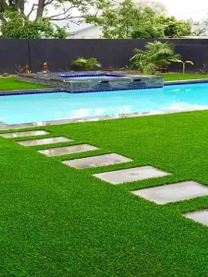A perfect lawn right by the pool, with no mud or grass clippings getting in the water. My artificial turf is durable, drains quickly, and looks incredible year-round, making it the ideal choice for poolside landscaping and outdoor entertainment areas.