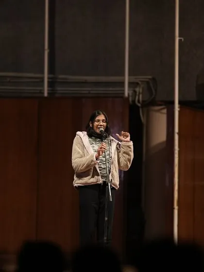 A poet engaging with the student audience at IIT Delhi. The connection with the crowd is a key part of our performances.