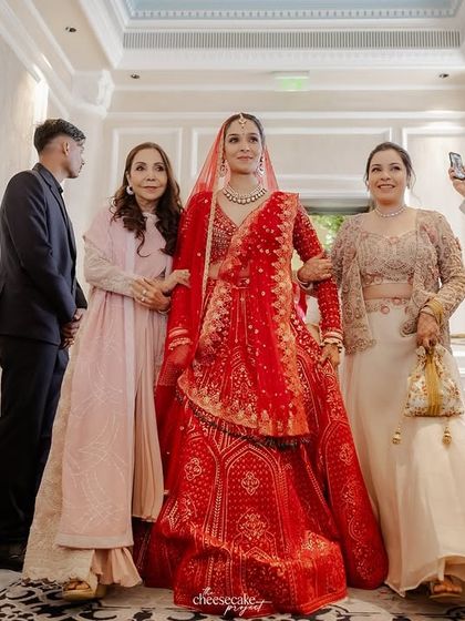 The bride's grand entrance, escorted by her family, a moment filled with pride and emotion.