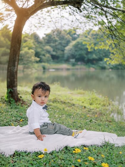A pensive moment for the birthday boy by the lake. Outdoor sessions offer such beautiful and serene backdrops.