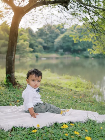 A serious and soulful look from the birthday boy, sitting by a lake. The beautiful golden light makes this a stunning portrait.