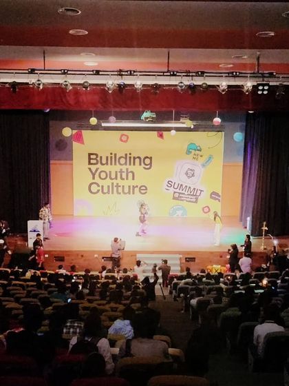 A wide shot of the auditorium during my performance at the Under 25 Summit. It's amazing to see a full house of young people connecting with the music.