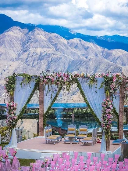 We specialize in finding and managing spectacular destination wedding venues. This breathtaking mountain-view mandap combines natural beauty with elegant decor for a truly unforgettable ceremony.
