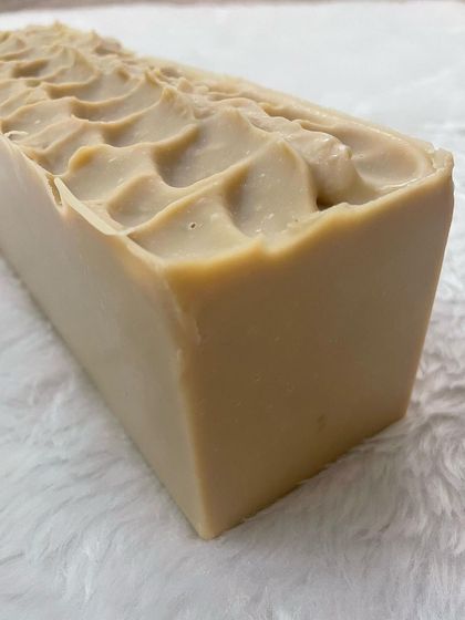 (Duplicate of 20) A side view of the cold processed Multanimitti soap loaf before it's cut. The smooth, creamy texture is a result of using high-quality oils and butters.