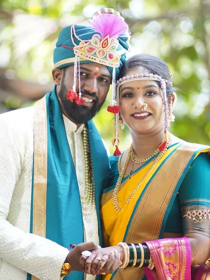 A classic portrait of the happy couple. The bride's makeup is perfectly coordinated with her attire, creating a harmonious and visually stunning look.