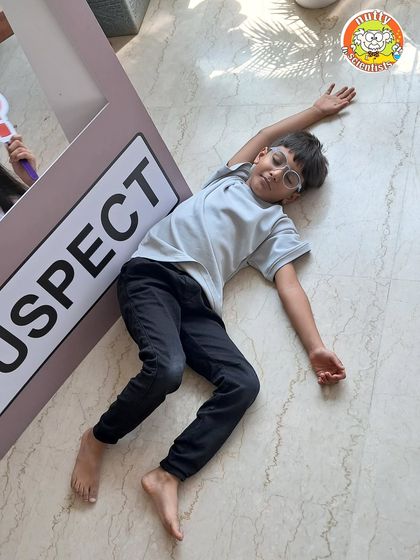 Case closed, and the suspect is down! The playful drama of a crime scene investigation makes for hilarious and memorable moments during the party.