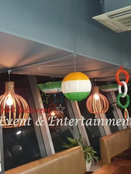For this office cafeteria, I used hanging tricolor rings and other themed elements to decorate the space for Independence Day, ensuring even break times feel festive.