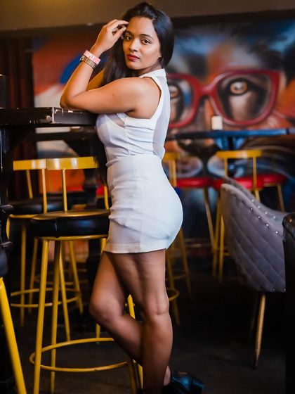 A guest posing at the bar.