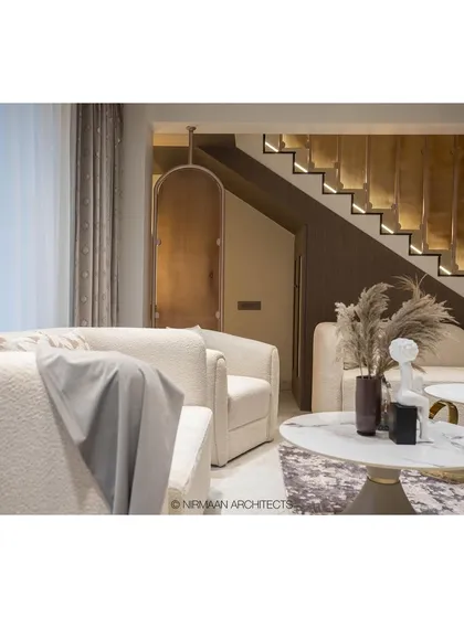 A detail shot of the living area in the Duplex Project, focusing on the plush, textured sofas and the elegant coffee tables. We believe luxury is conveyed through high-quality materials and finishes.