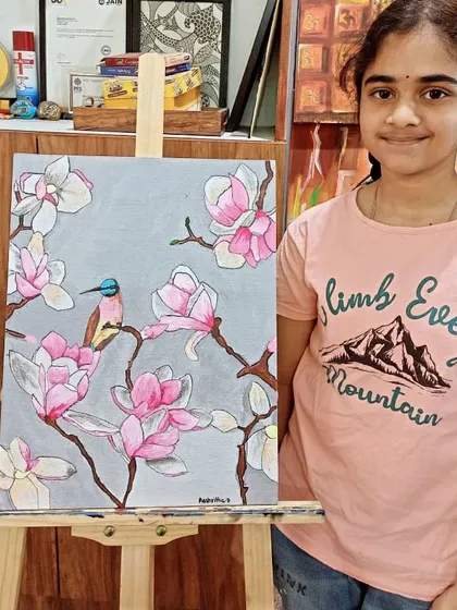 A teen student with her beautiful painting of a bird among magnolia blossoms. This piece combines line work with soft coloring, a great technique for illustrative styles.
