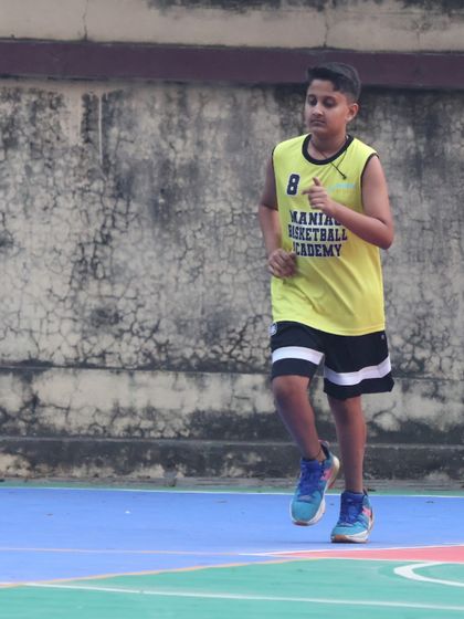 A young player jogs back on defense, showing the hustle we expect from everyone. The grind includes playing hard on both ends of the court.