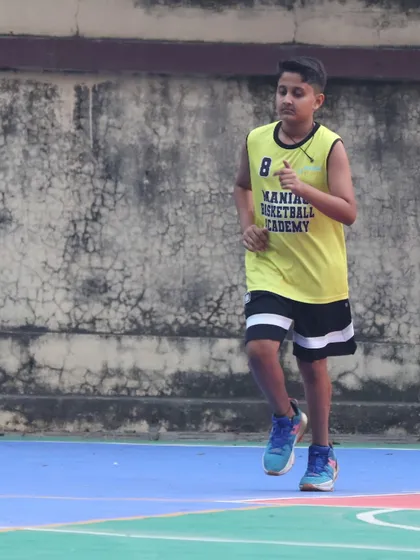A young player runs a conditioning drill. Fitness and stamina are just as important as skill, and we train our players to be complete athletes.