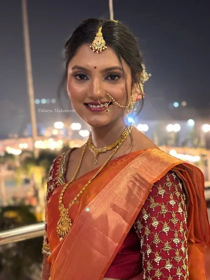 The joy of a bride on her special day. This candid shot captures her radiant smile, enhanced by a makeup look that is both traditional and fresh, perfect for wedding photography.