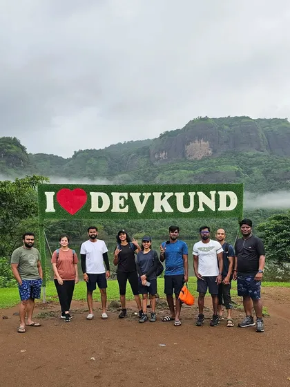 The group at the "I Love Devkund" sign, a popular photo spot before starting the trek to the waterfall.