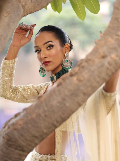 A beautiful shot of the bride through the trees, creating a natural and ethereal vibe.