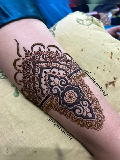 A close up of an arm band from a Pakistani bridal design.