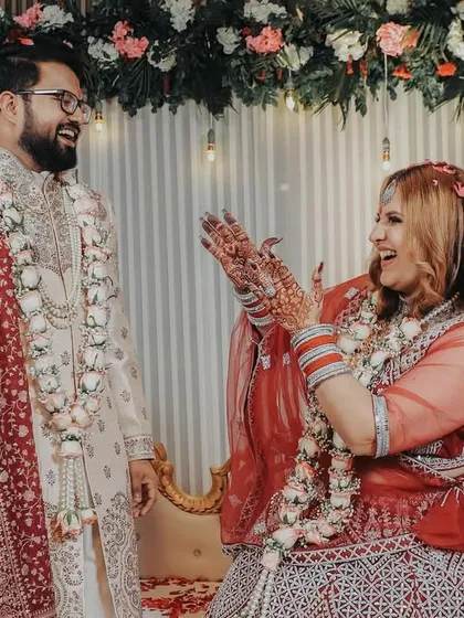 A candid moment of laughter during the ring ceremony. The bride's joyful expression as she interacts with her groom shows the fun and relaxed atmosphere I love to create.