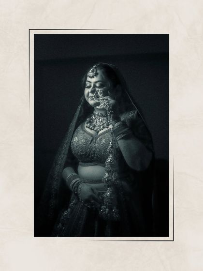 A moody, artistic black and white portrait of Ishita, her eyes closed, capturing a moment of quiet contemplation.