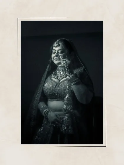 A moody, artistic black and white portrait of Ishita, her eyes closed, capturing a moment of quiet contemplation.