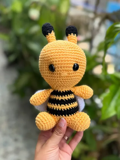 Our bumblebee amigurumi is buzzing with cuteness. With its tiny wings and friendly face, it's a sweet addition to any toy collection.