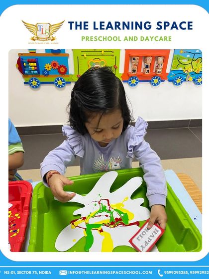 A child creates a colorful handprint for Holi. Art is a wonderful medium for children to engage with festivals and express their excitement.