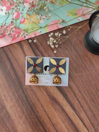 My gotapatti earrings are a festive favorite. These square fabric studs feature golden gotapatti work and a small jhumki drop, available in brown, green, and grey.