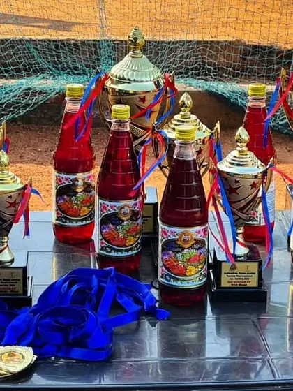 The trophies, medals, and refreshments ready for our tournament's closing ceremony. We make sure to celebrate the hard work of all participants.