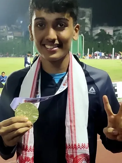 Jason Castelino proudly showing his Gold medal from the Junior National Athletics Championship.