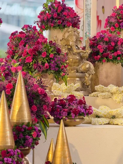 Different angles of the auspicious welcome corner. The Ganesha idol, a symbol of new beginnings, is beautifully adorned with flowers, setting a blessed tone for the celebration.